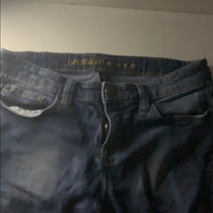 distressed jeans with zipper on ankle